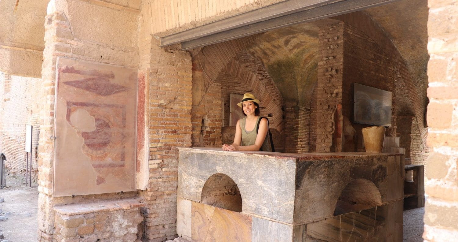 Dr. Vennarucci standing behind a counter in Ostia